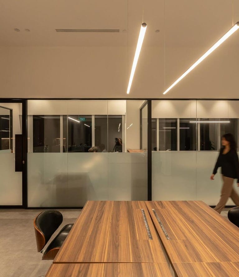 Lansoln Consultancy modern conference room with wooden meeting table and glass partition walls