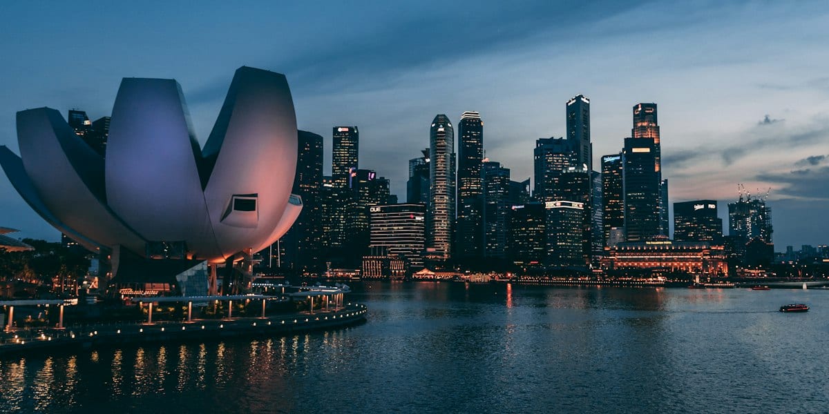 Singapore central business district skyline at dusk, reflecting Lansoln Consultancy's global corporate advisory reach